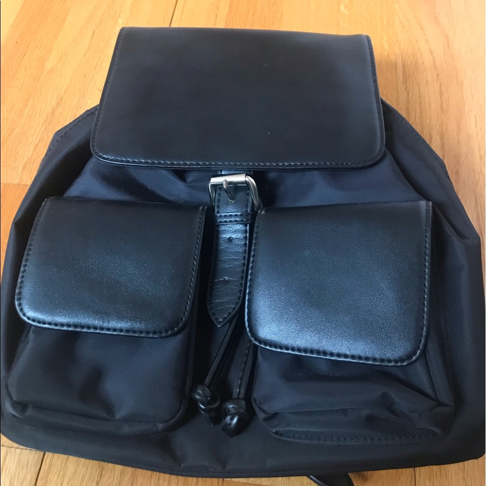 Nylon with leather trim backpack handbag. New